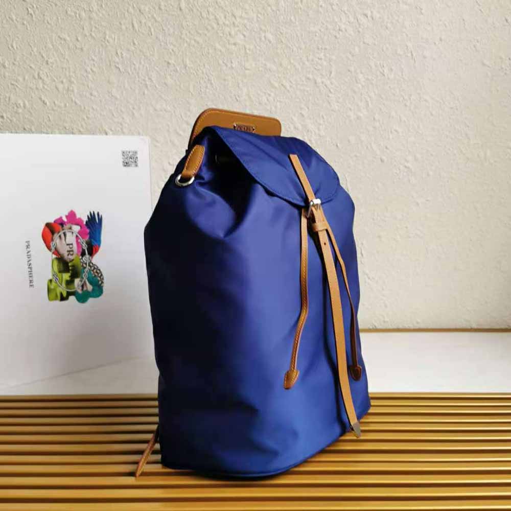Side angle showing zip closure of Prada Women Nylon and Saffiano Leather Backpack-Blue