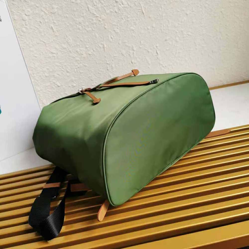 Side angle showing silver-tone hardware on Prada Women Nylon and Saffiano Leather Backpack-Green