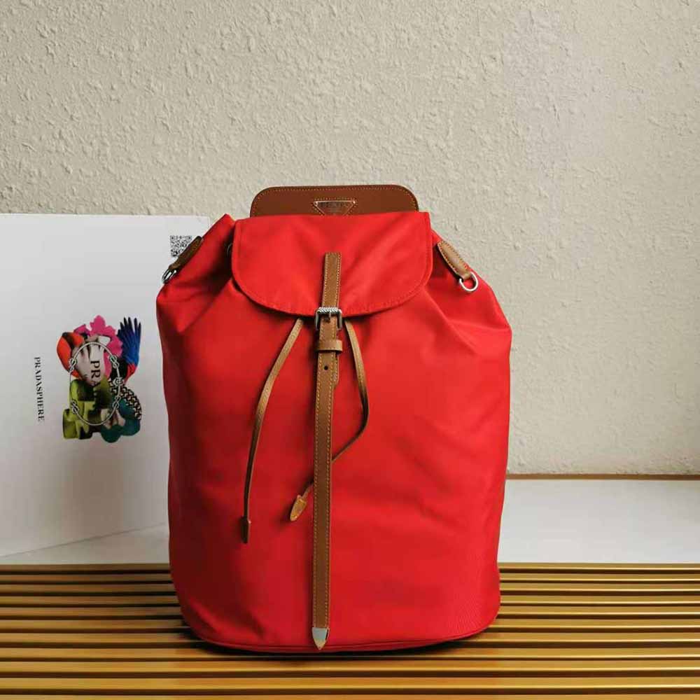Close-up of saffiano leather and silver hardware on Prada red backpack