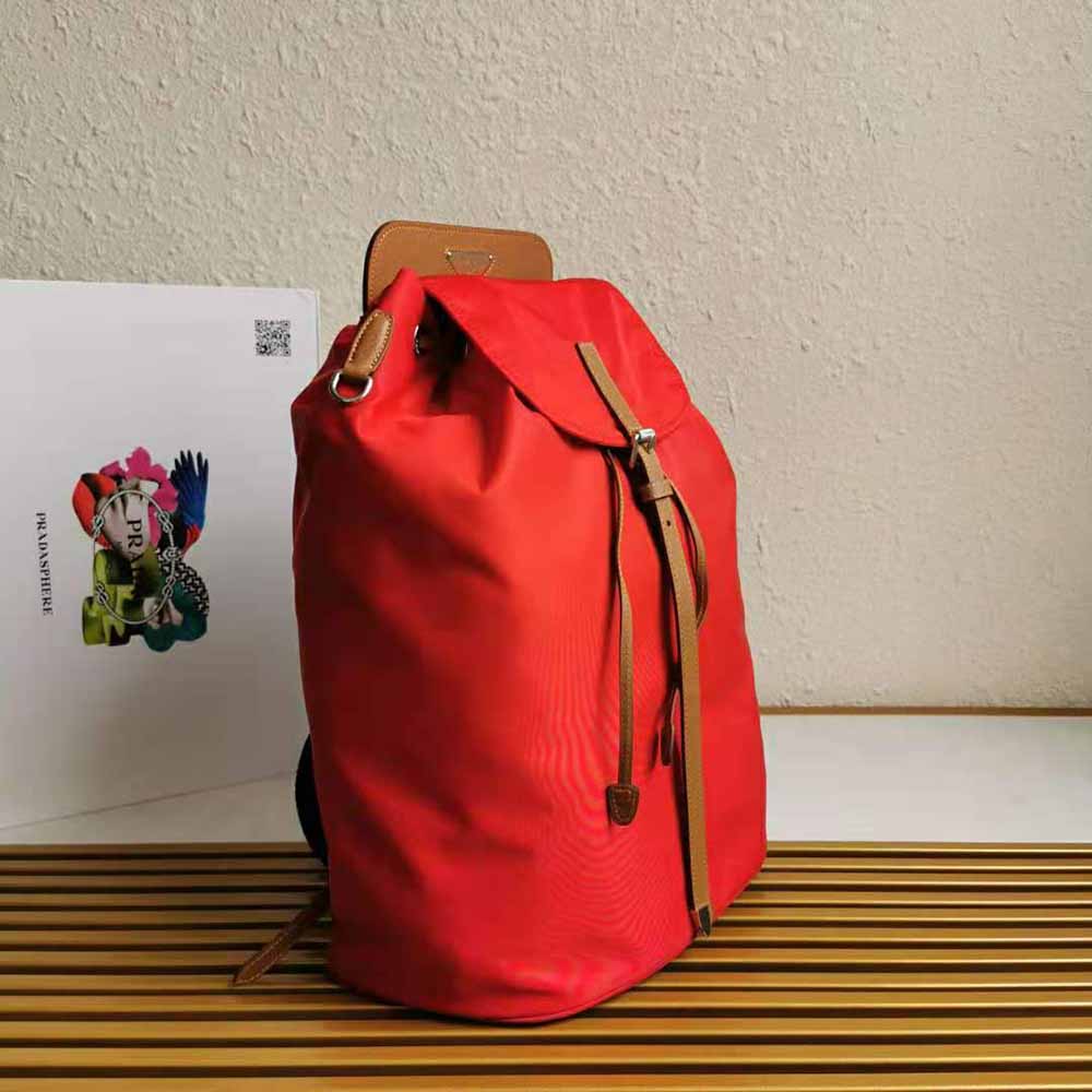Side angle showing adjustable straps on Prada Women Nylon and Saffiano Leather Backpack-Red