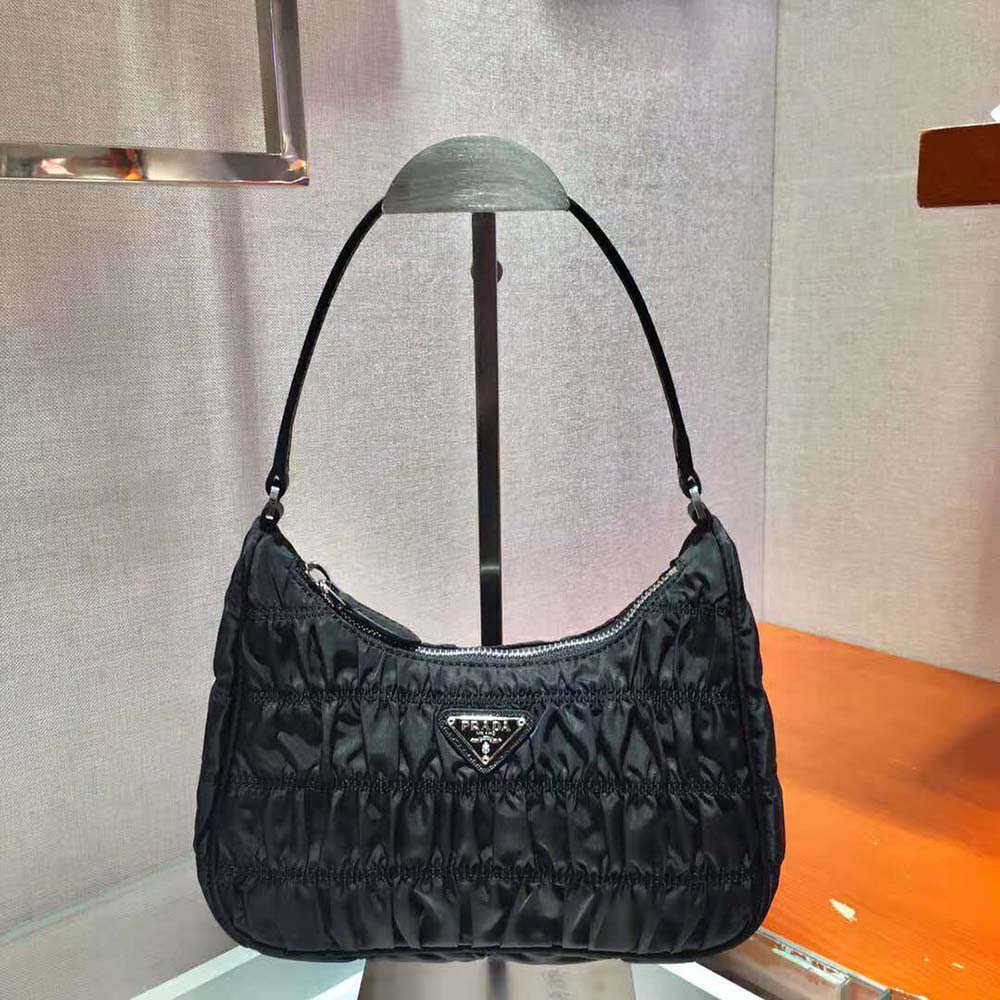 Close-up of saffiano leather trim and silver hardware on Prada mini bag
