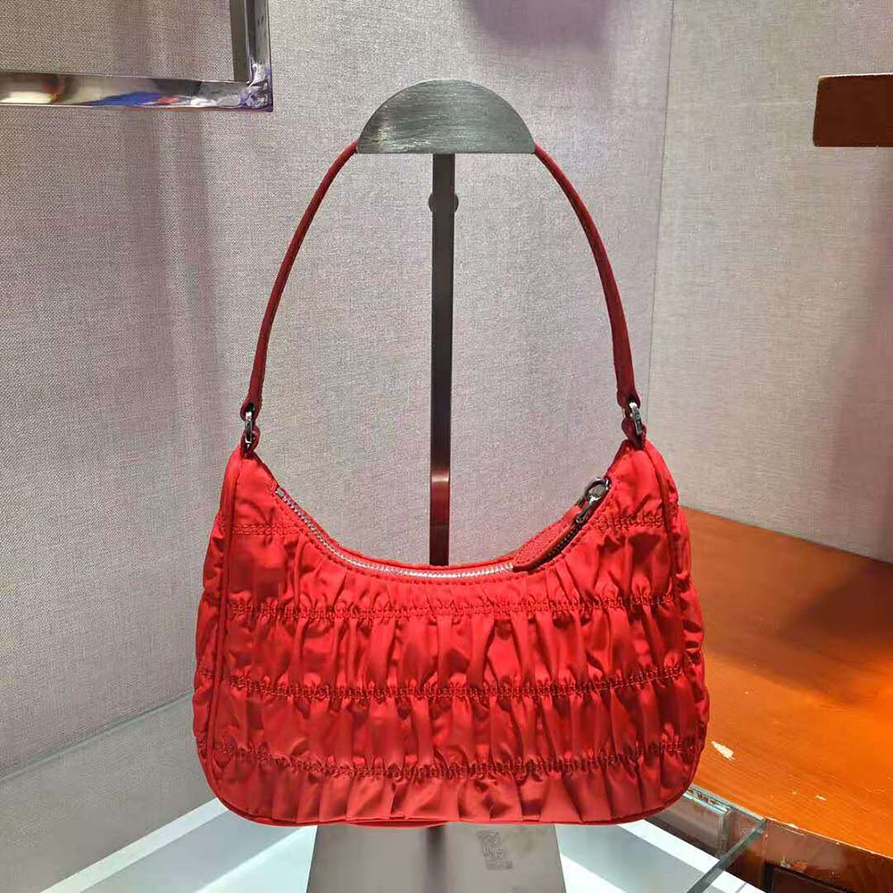 Side profile showing strap detail on Prada Women Nylon and Saffiano Leather Mini Bag-Red