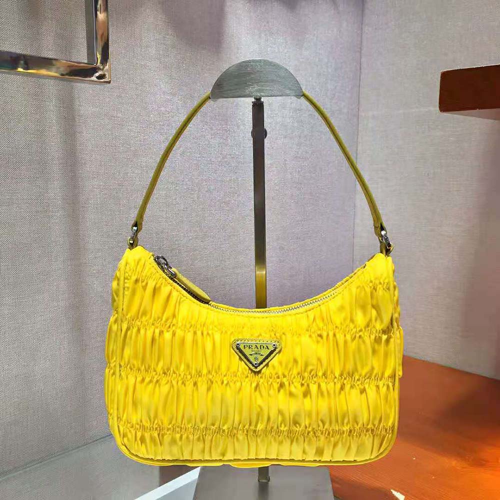 Close-up of gold hardware and saffiano leather on Prada bag