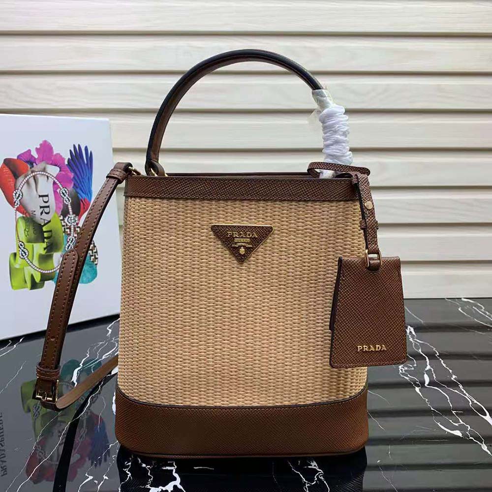 Close-up of brown leather trim and gold Prada logo plaque