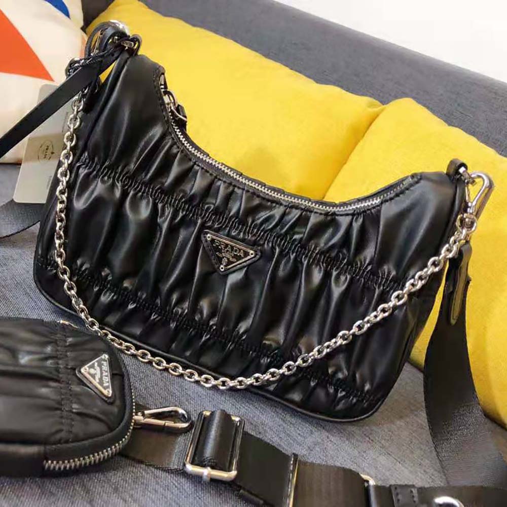 Side angle showing silver hardware on Prada Re-Edition 2005 Nappa Gaufre Bag
