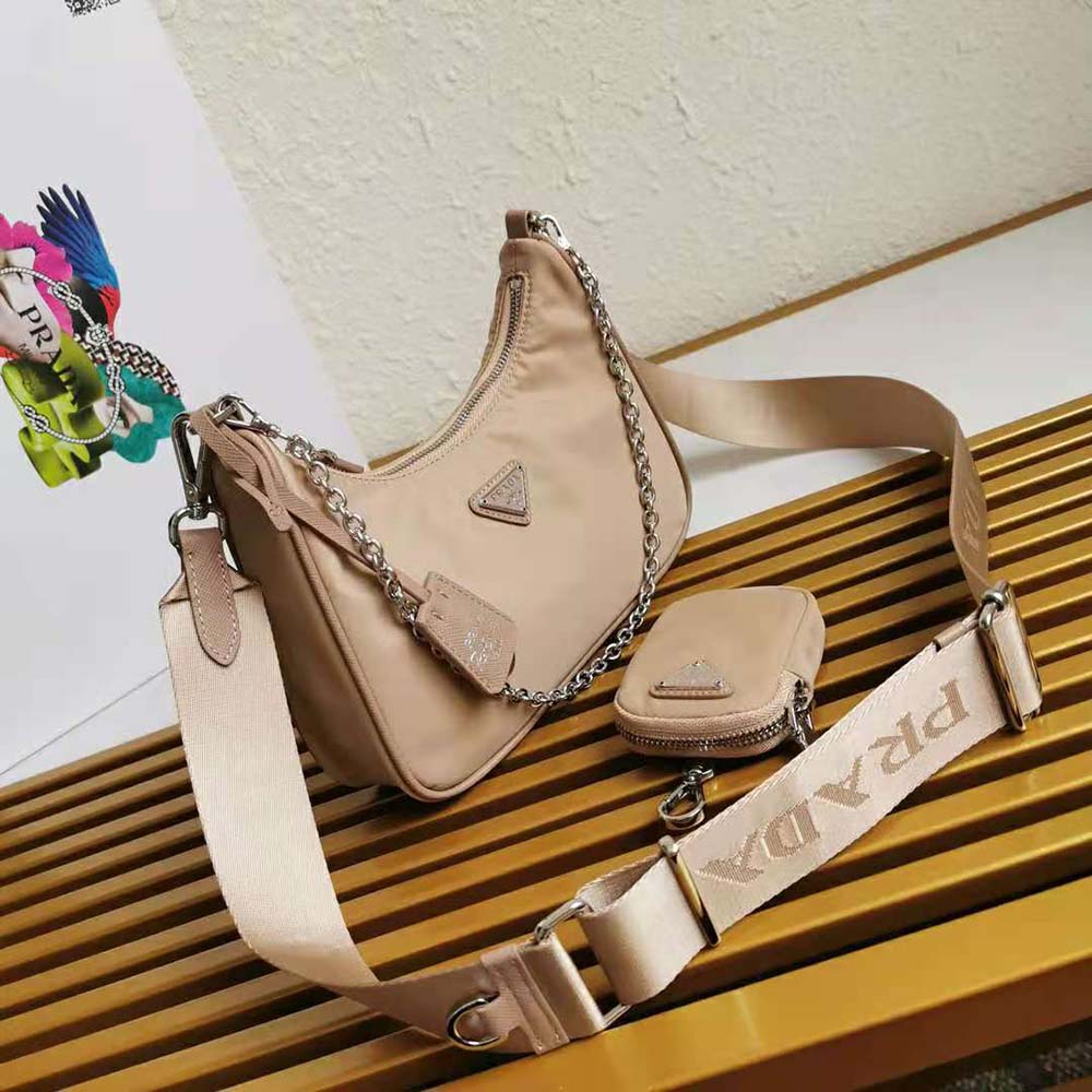 Side angle showing pink nylon texture and adjustable strap of Prada bag