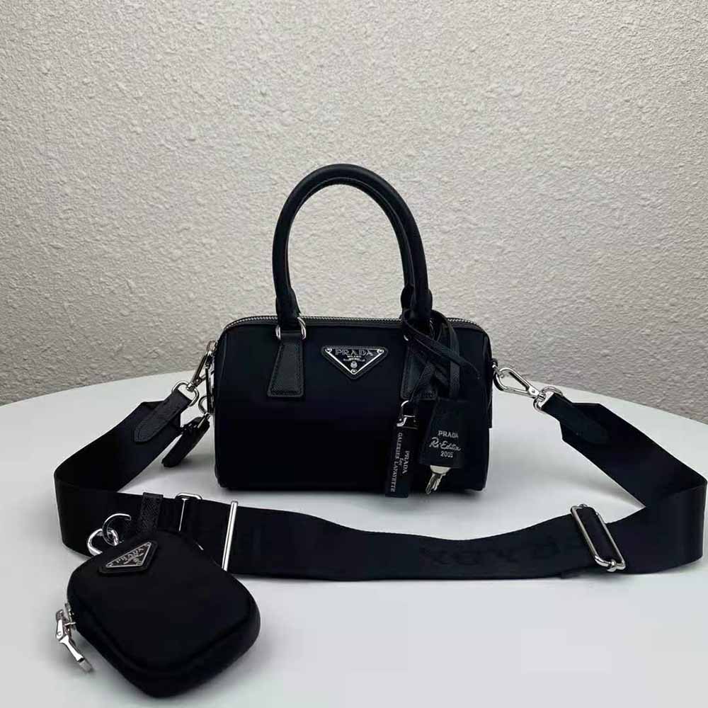 Close-up of black nylon fabric and Prada logo plaque on the bag