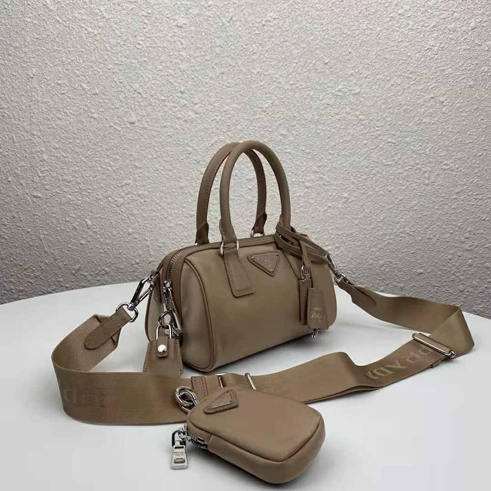 Side angle showcasing silhouette and zipper closure of Prada Re-Edition bag sandy