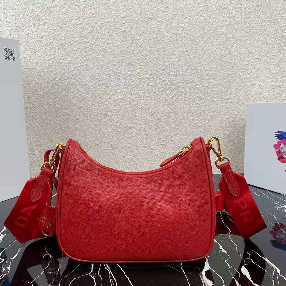 Side angle showing silver hardware and strap of Prada Re-Edition 2005 bag
