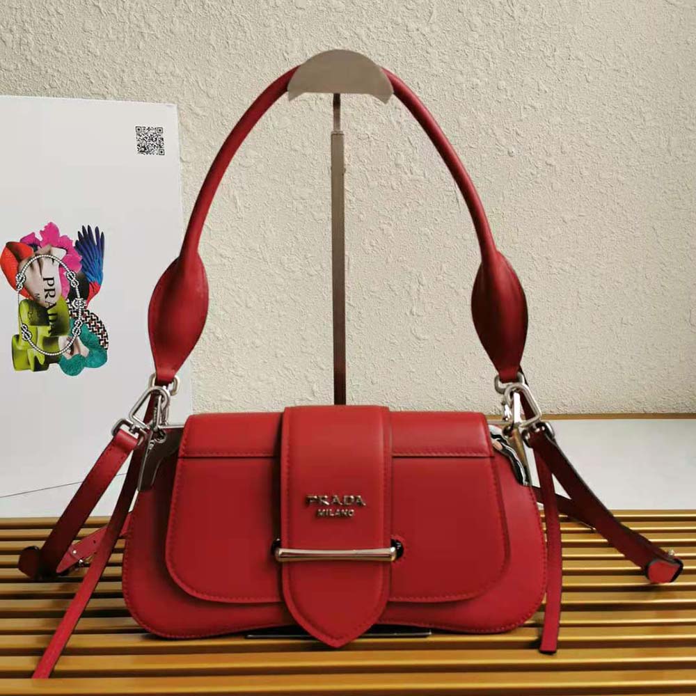 Close-up of red calf leather and gold hardware on Prada Sidonie bag