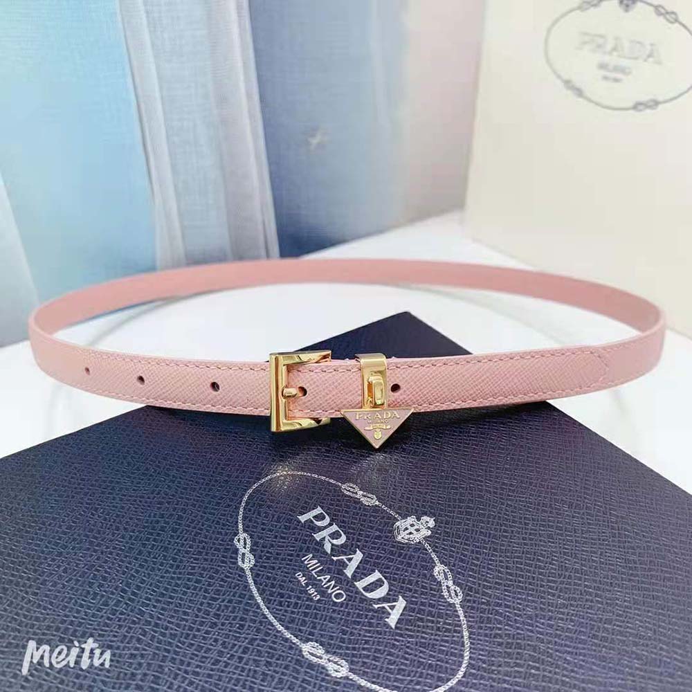 Close-up of textured pink leather and Prada logo on belt