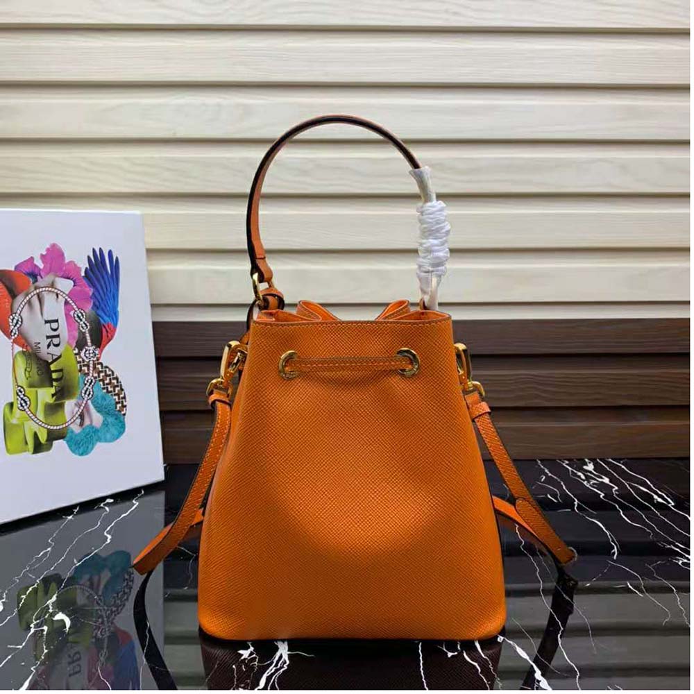 Side profile showing structured silhouette of Prada Women Saffiano Leather Bucket Bag-Orange