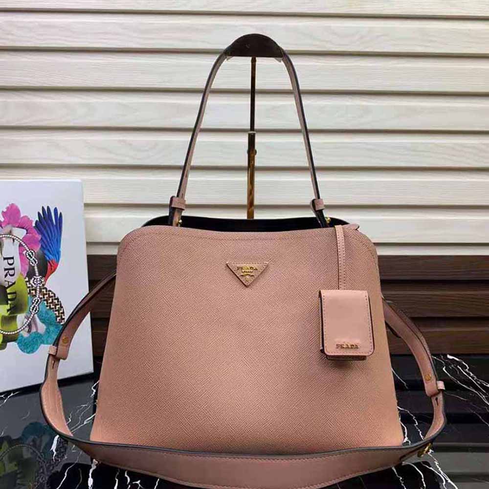 Close-up on silver hardware of Prada Women Saffiano Leather Prada Matinee Bag-Pink