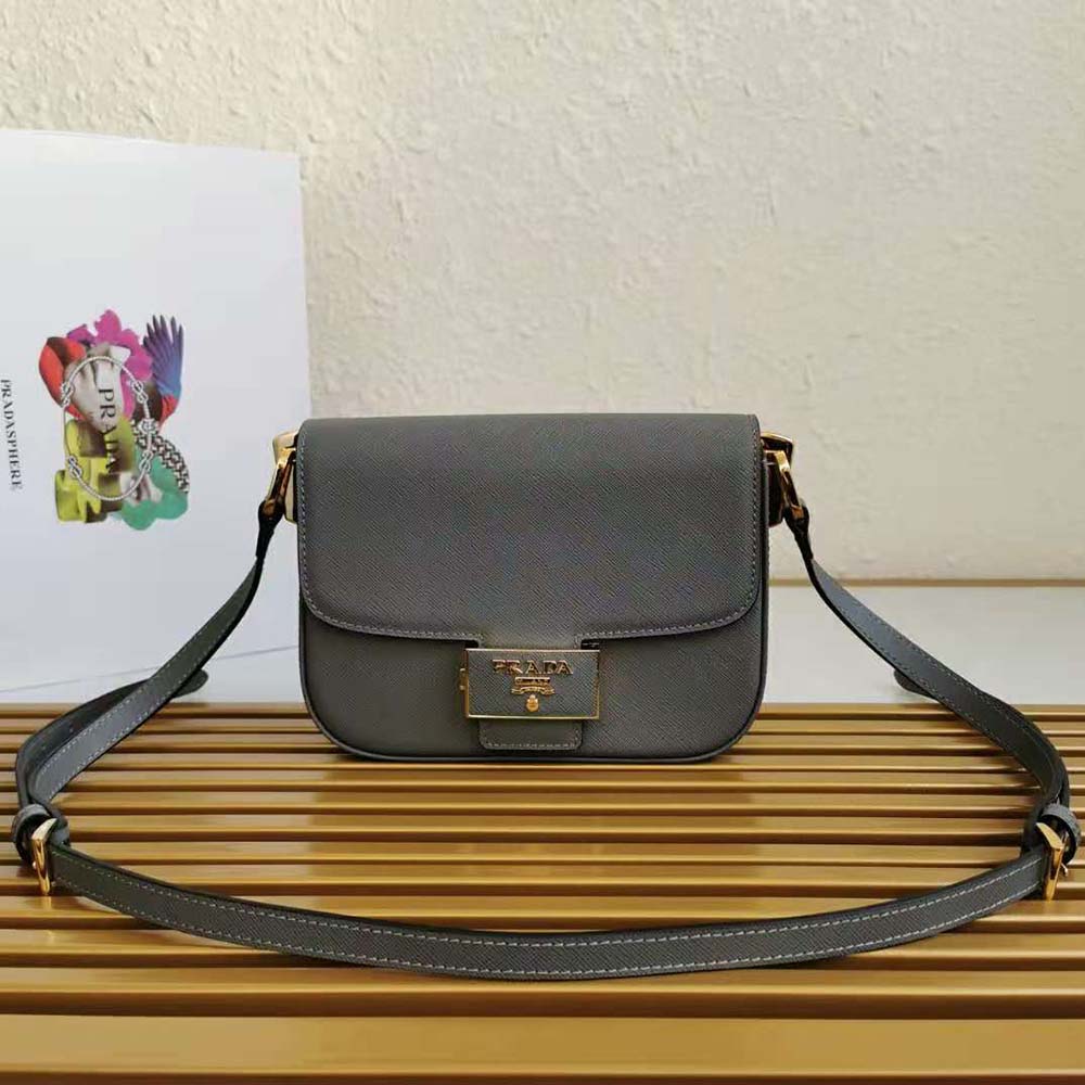 Close-up of gray Saffiano leather texture and Prada Embleme on shoulder bag