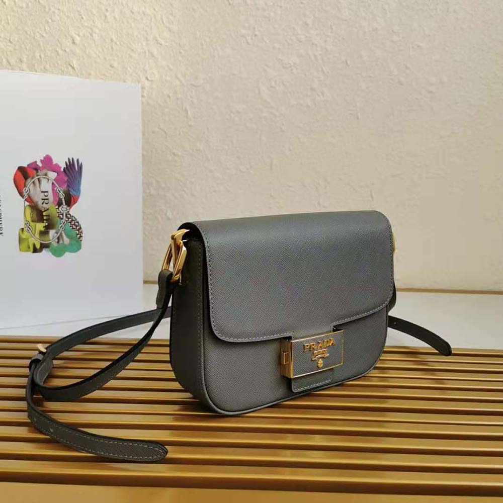 Side angle of Prada Women Saffiano Leather Prada Embleme Bag-Gray with adjustable strap