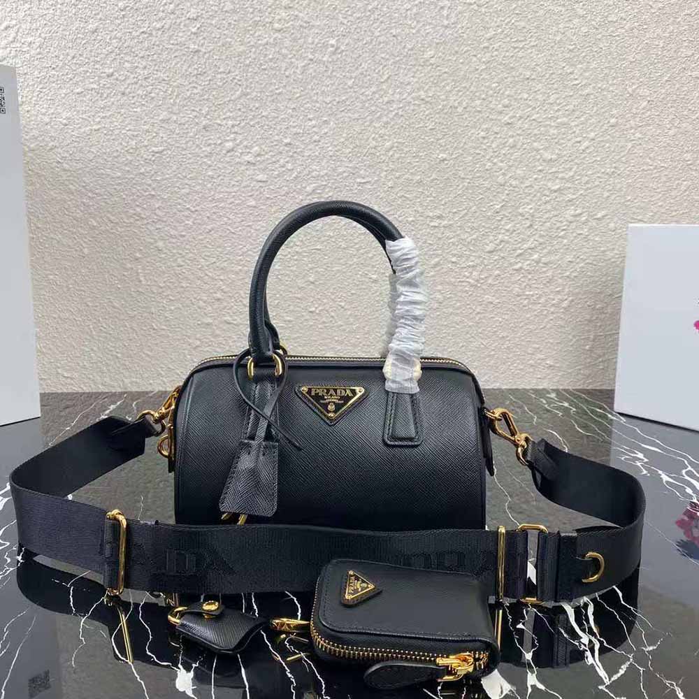 Close-up of gold-tone hardware on Prada Women Saffiano Leather Top-handle Bag-Black