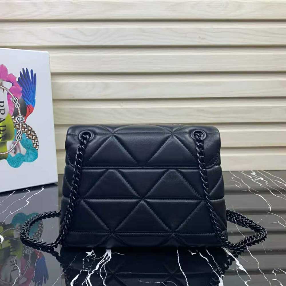 Side angle showcasing structured silhouette of Prada Women Small Nappa Leather Prada Spectrum Bag-Black