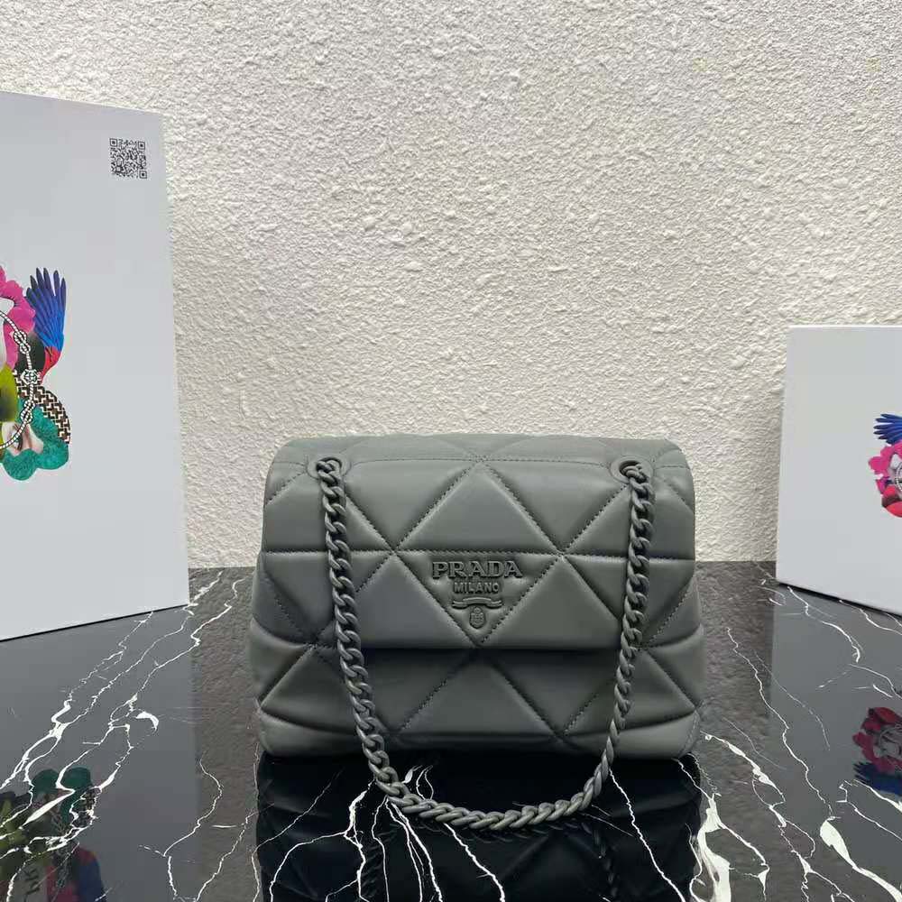 Close-up on silver Prada Spectrum hardware detail on bag