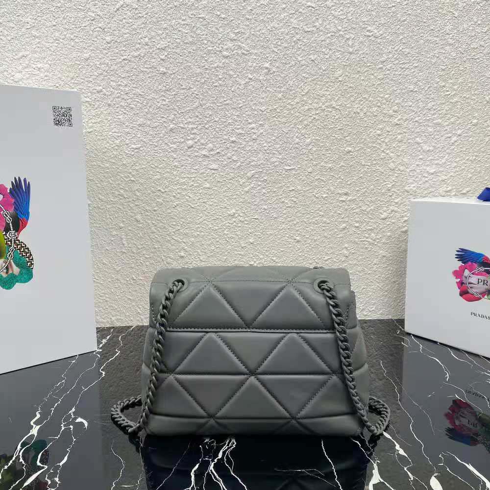 Side angle showing compact silhouette of Prada Spectrum Bag-Silver