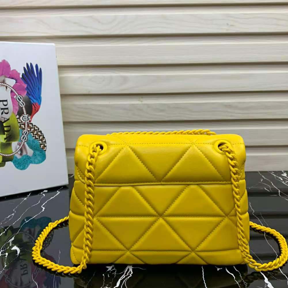 Side profile showing structured silhouette of Prada Spectrum Bag-Yellow
