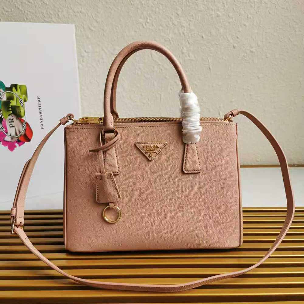 Close-up of gold hardware and logo on Prada Women Small Saffiano Leather Prada Galleria Bag-Sandy
