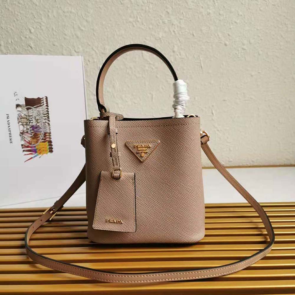 Close-up of gold-tone hardware on Prada Women Small Saffiano Leather Prada Panier Bag-Sandy