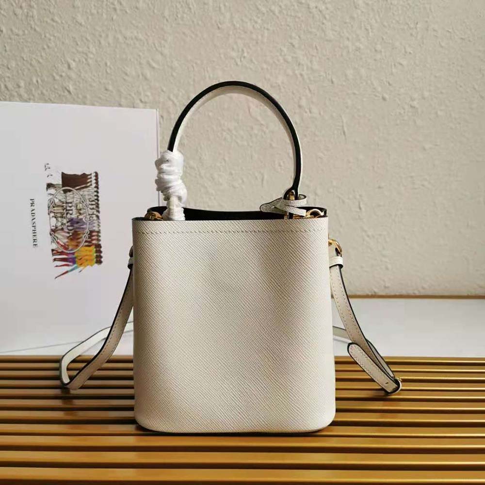 Side profile showing compact silhouette of Prada Women Small Saffiano Leather Prada Panier Bag-White