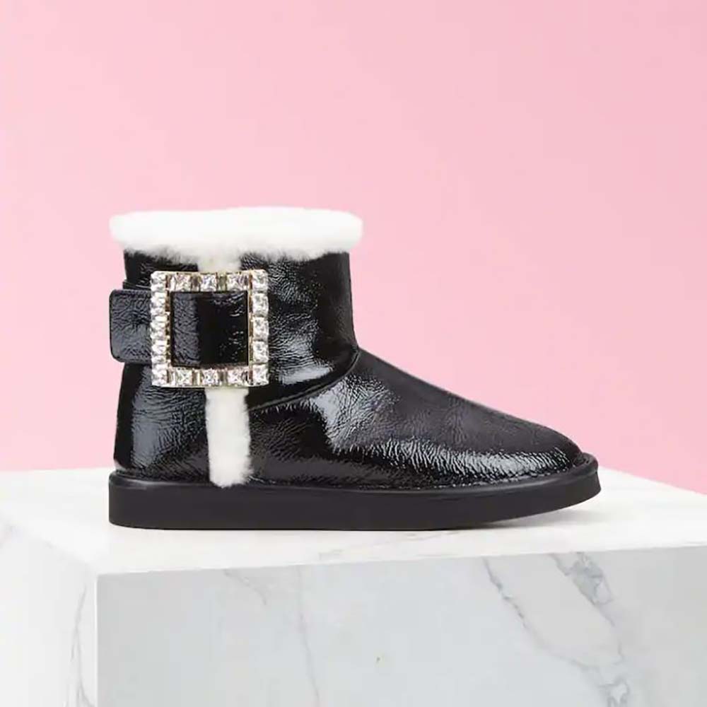Side view of Roger Vivier Winter Viv’ Strass Buckle Booties in black patent leather