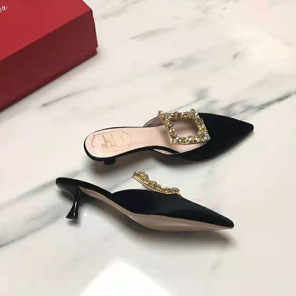 Rear angle showing 4.5 cm heel and satin finish on Roger Vivier mules