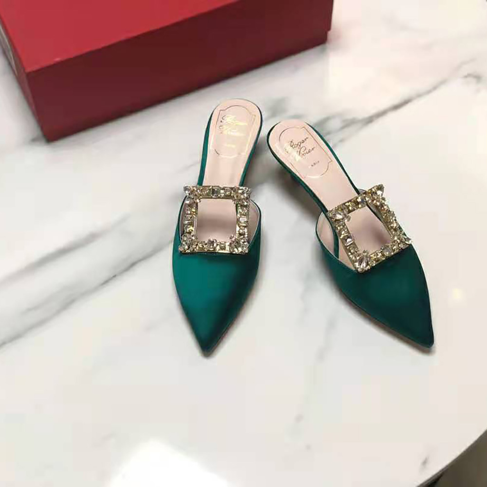 Close-up of silver-tone buckle detail on Roger Vivier Broche Vivier Buckle Mules
