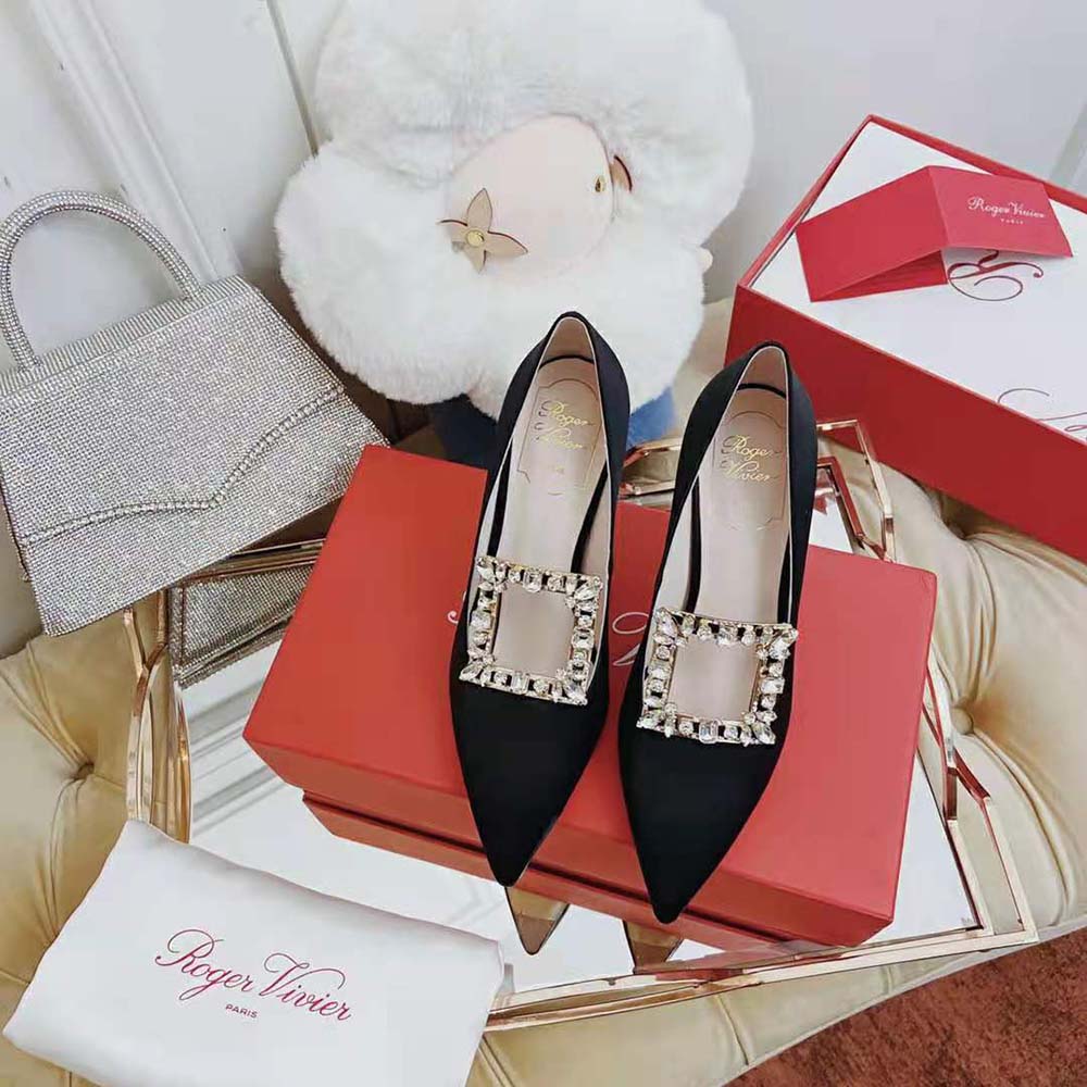Close-up of signature silver buckle on Roger Vivier Broche Vivier Pumps
