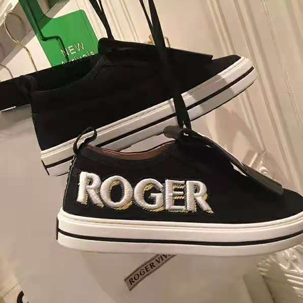 Overhead view showing laces and black leather texture of Roger Vivier Patch Sneakers