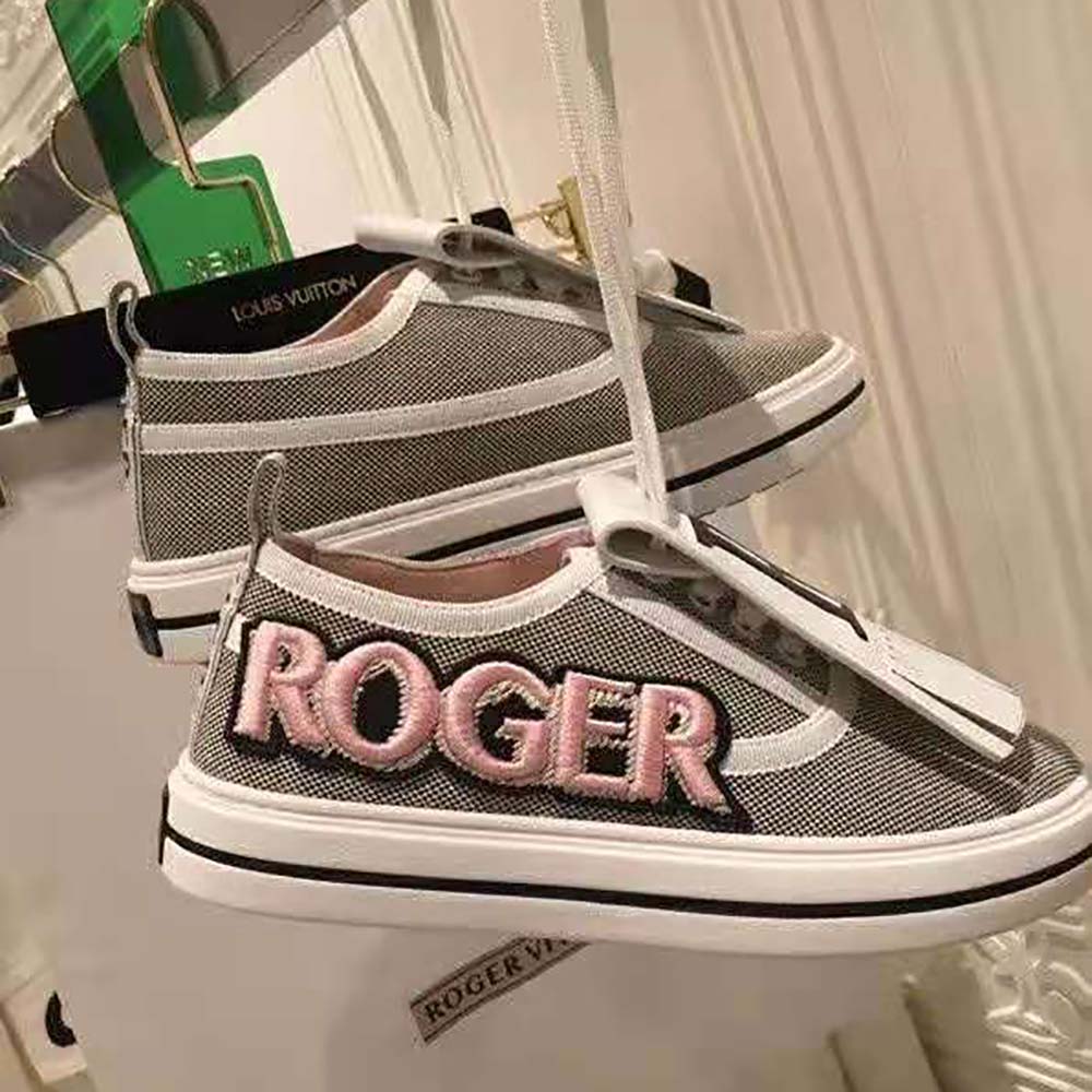 Overhead view showing metallic leather and rubber sole of sneakers