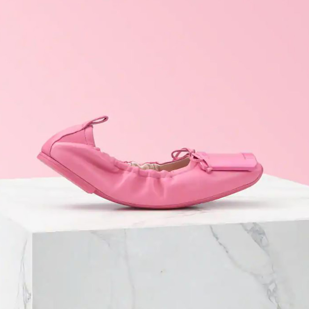 Side angle of Roger Vivier Women Viv’ Pockette Lacquered Buckle Ballerinas in pink
