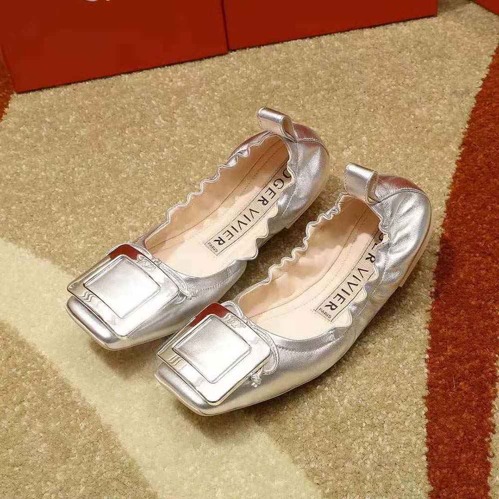 Close-up of signature metal buckle on Roger Vivier Viv’ Pockette ballerinas