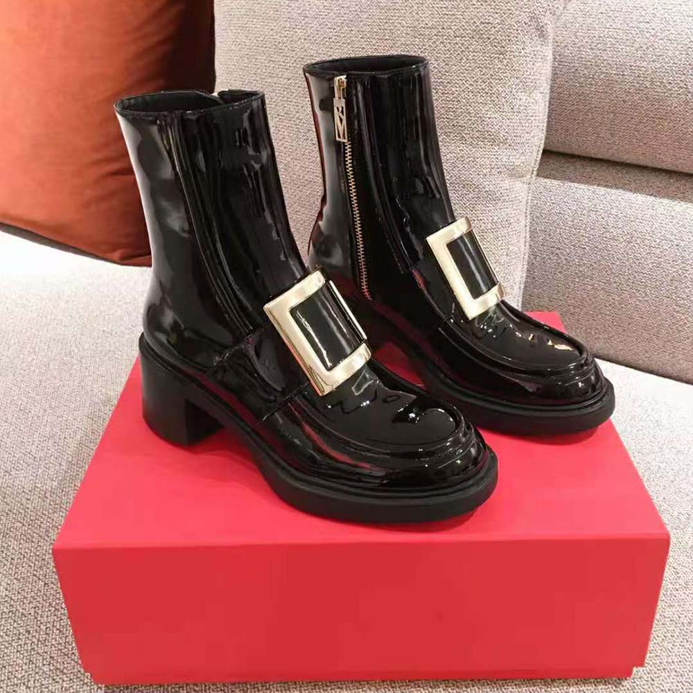 Close-up on metal buckle and pointed toe of Roger Vivier ankle boots