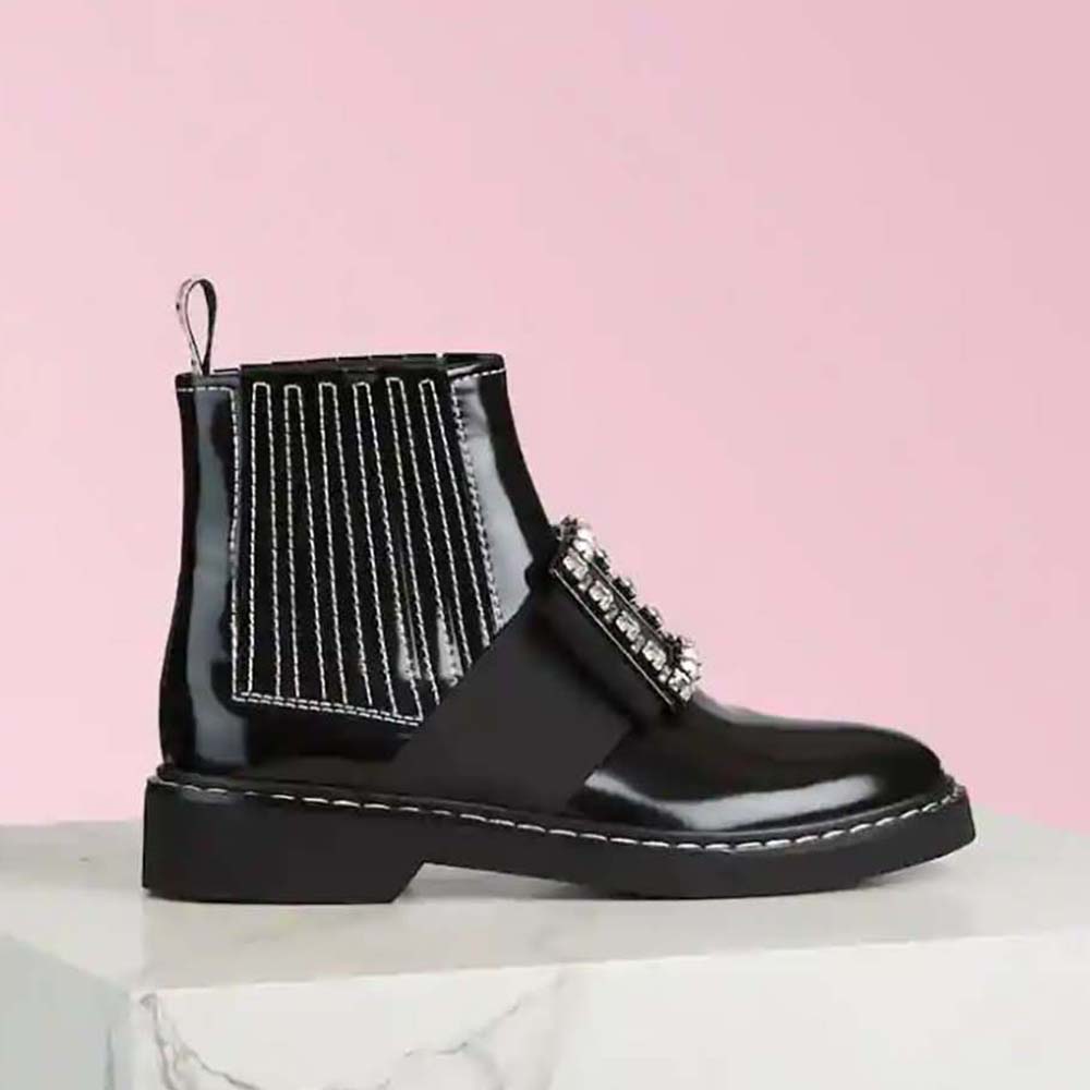 Side view of Roger Vivier Women Viv’ Rangers Stitch Strass Buckle Booties in black leather