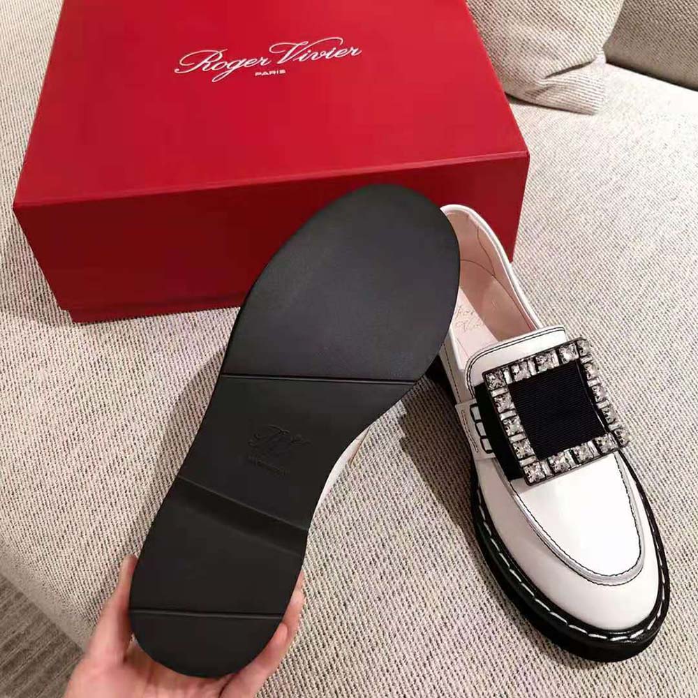 Close-up on signature strass buckle of Roger Vivier Viv’ Rangers loafers