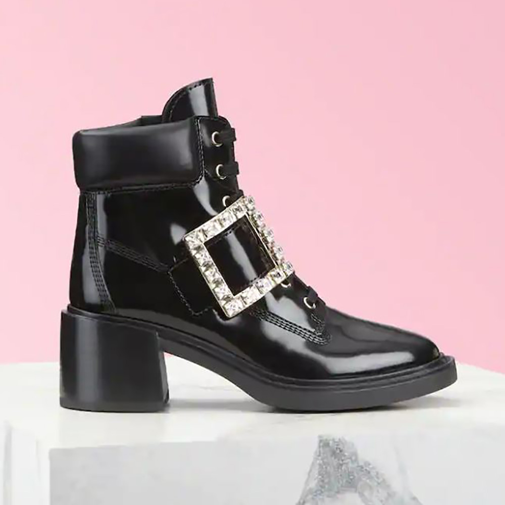 Side view of Roger Vivier Women Viv’ Rangers Strass Buckle Ankle Boots in black leather