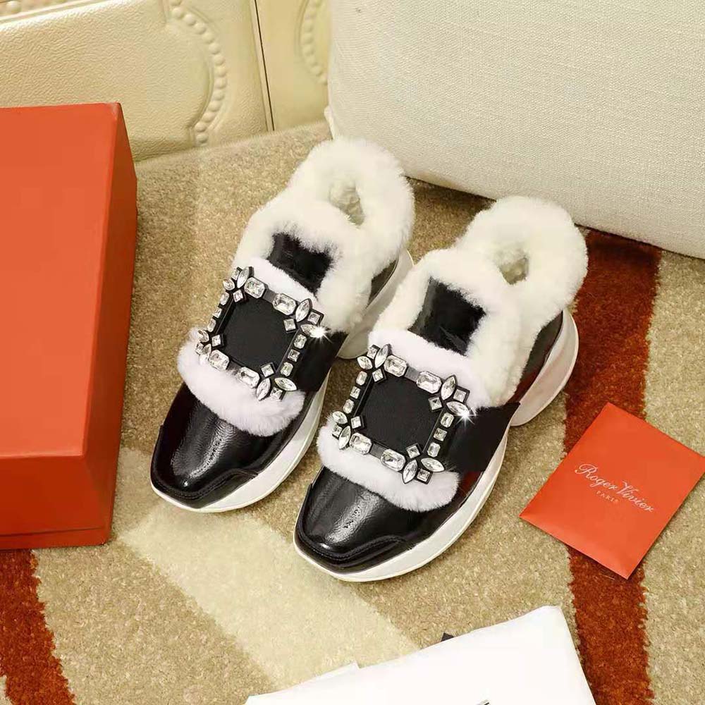Close-up of the sparkling Strass crystal buckle on Viv’ Run Shearling Sneakers