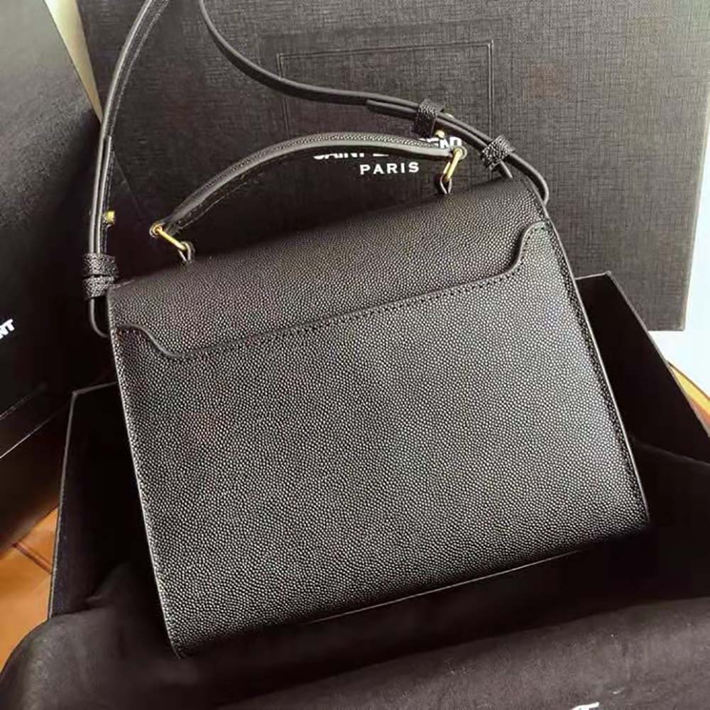 Side angle showing top handle and silver hardware on Saint Laurent Cassandra Mini Bag