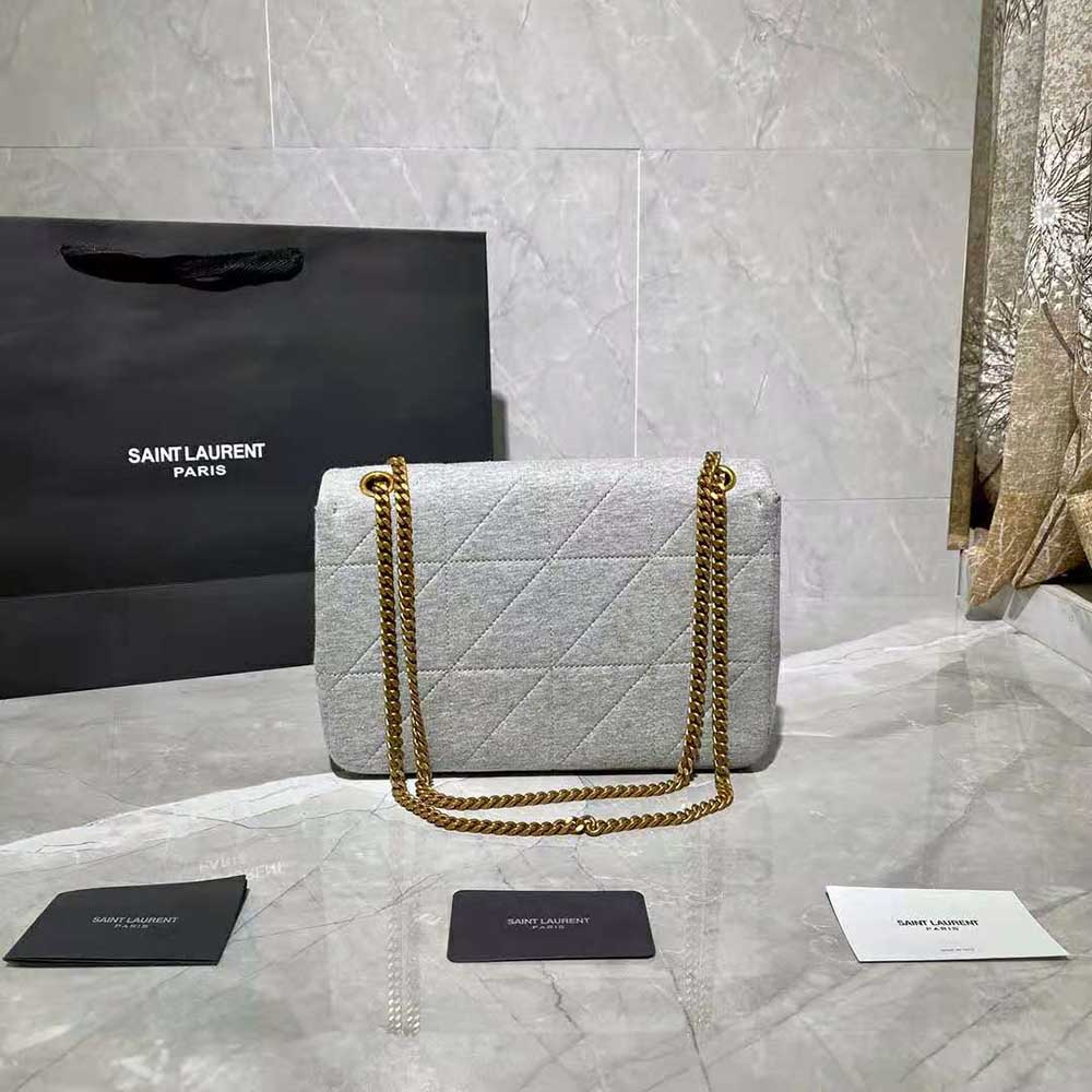 Side angle showing jersey texture and flap closure on Saint Laurent YSL bag