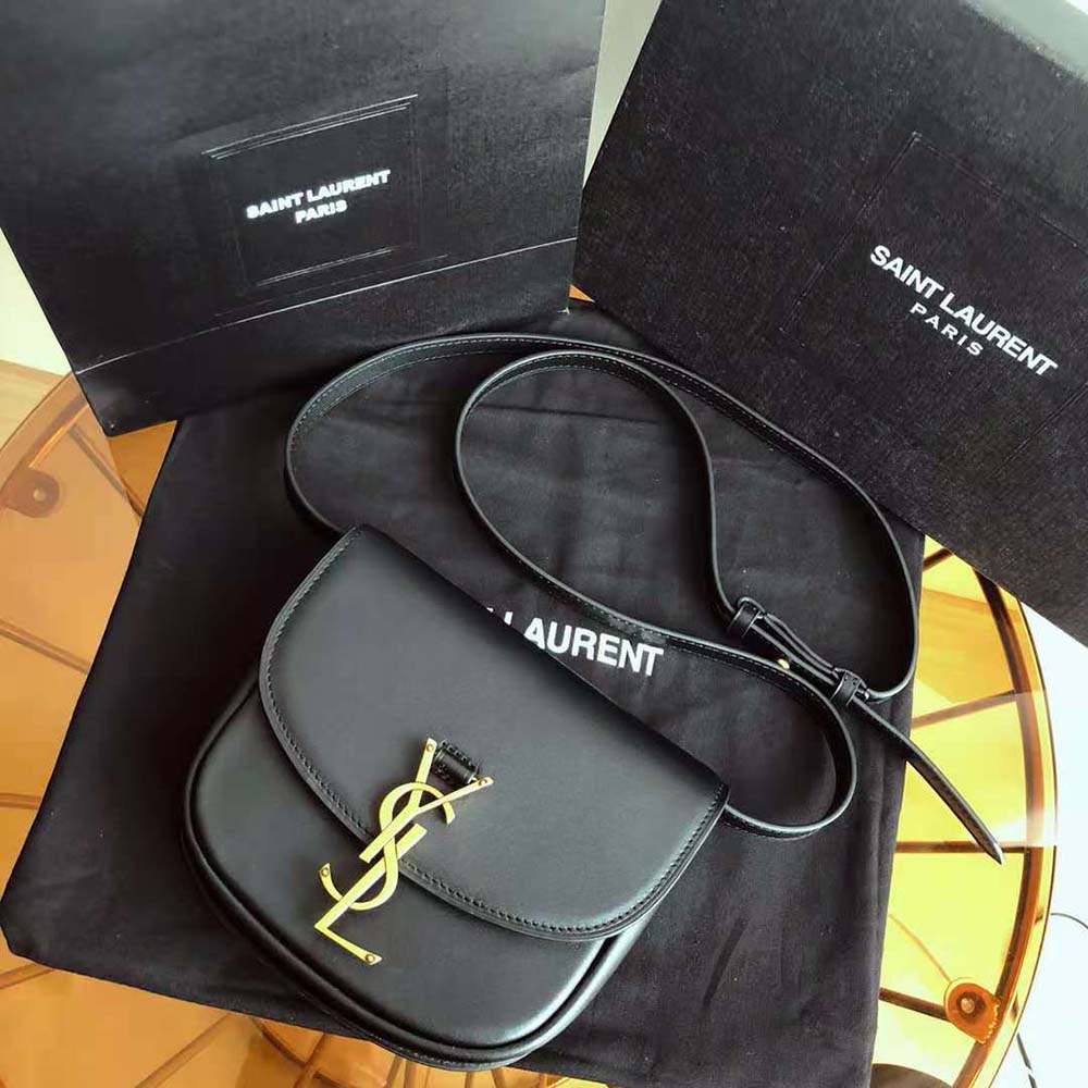 Close-up of gold YSL logo on Saint Laurent YSL Kaia Small Satchel