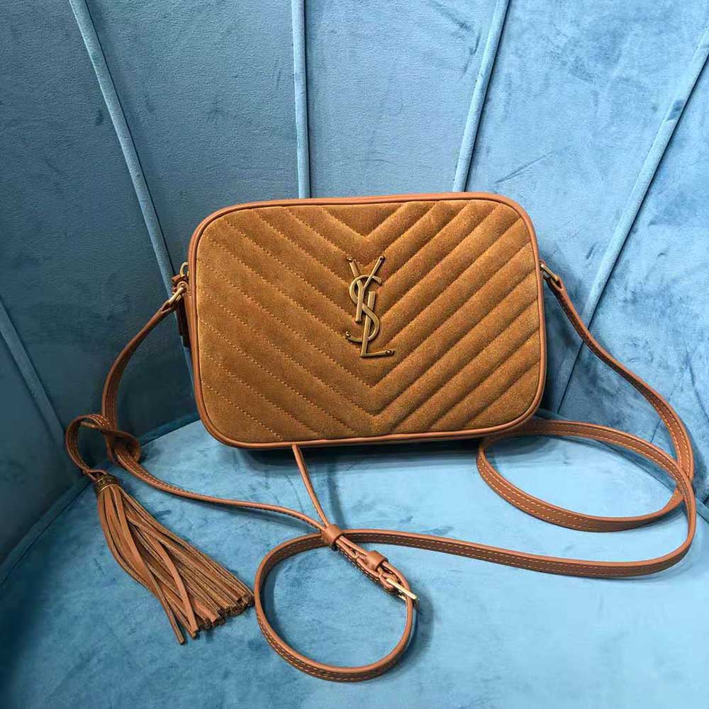 Close-up of gold YSL hardware on Lou Camera Bag in suede and leather