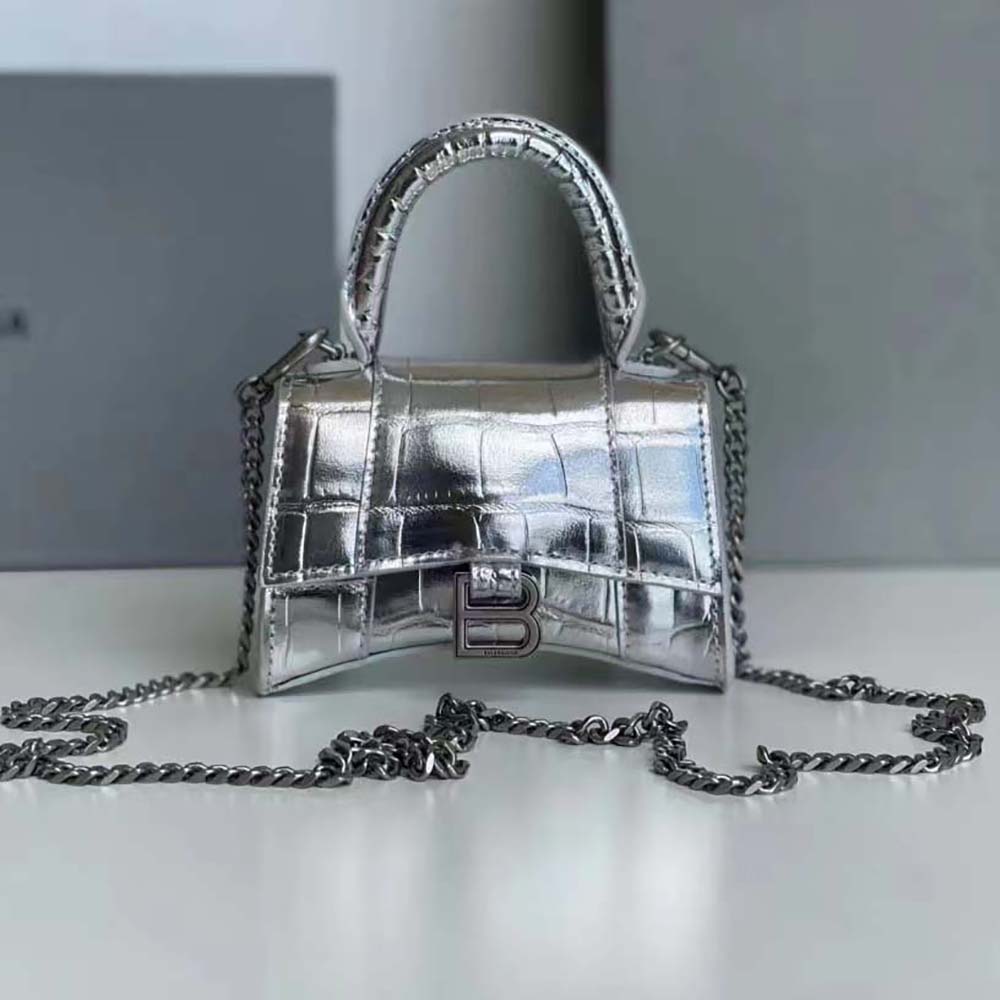 Close-up detail of silver crocodile embossed calfskin texture on Balenciaga bag
