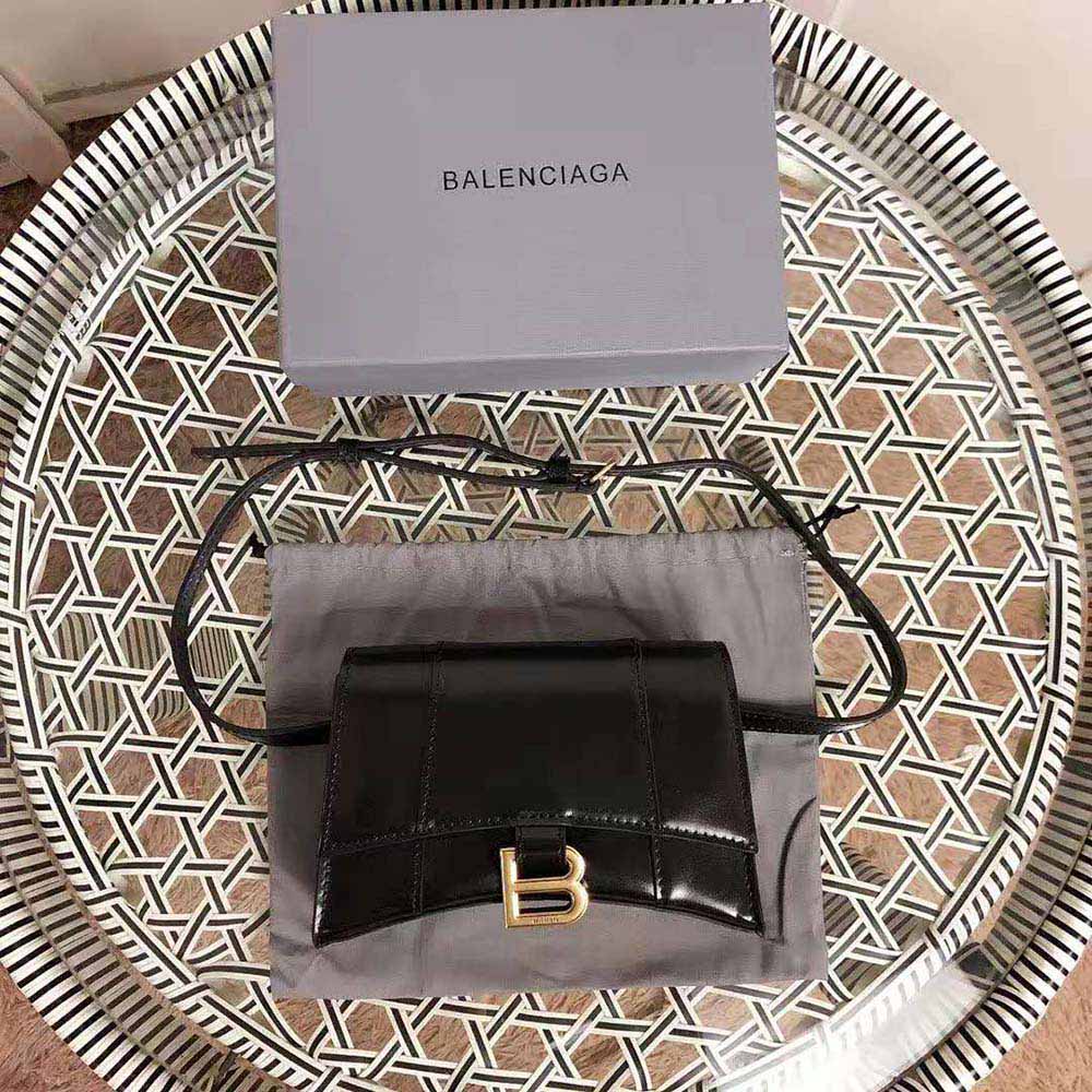 Side angle showing curved silhouette of Balenciaga Women Hourglass Small Beltbag in black