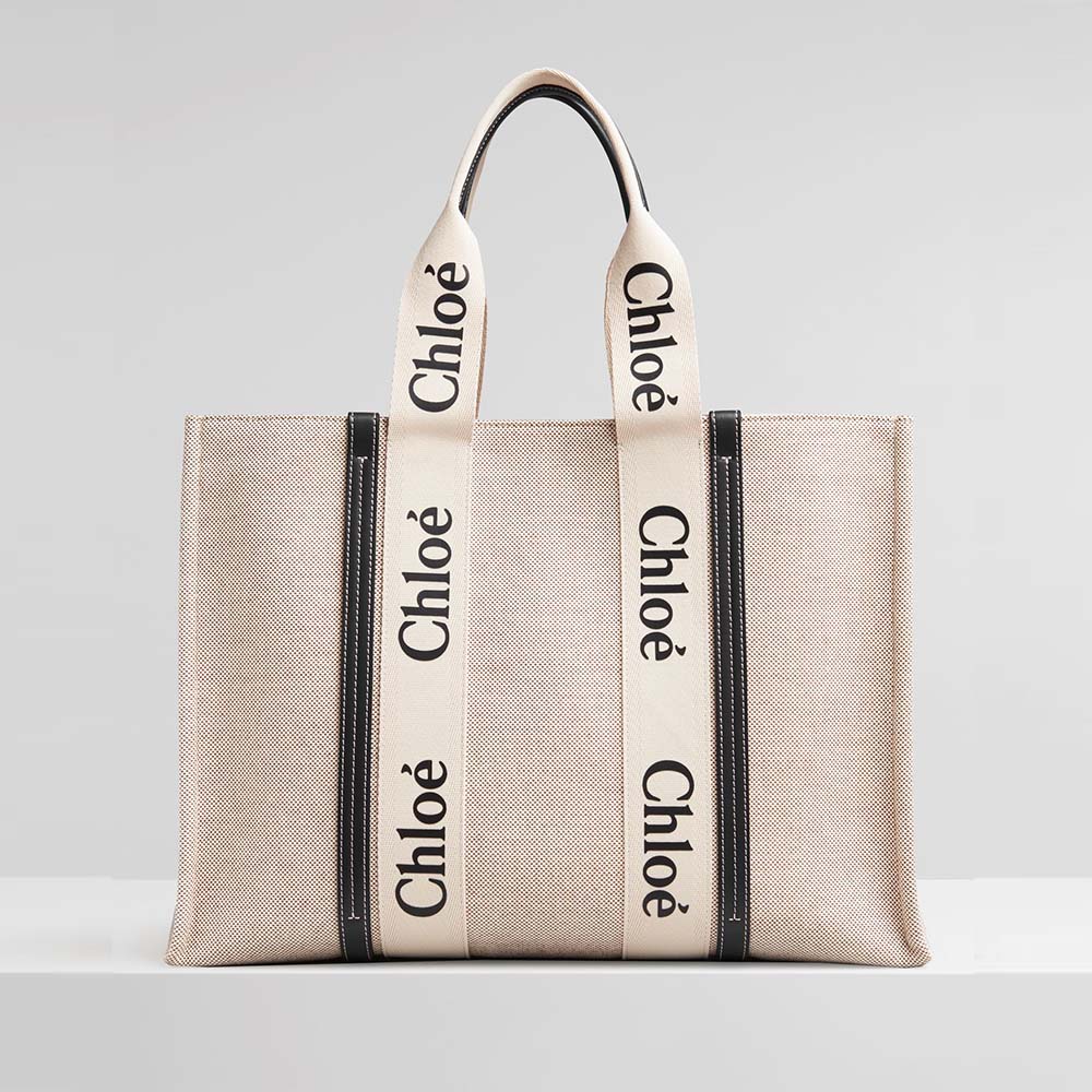 Front angle view of Chloe Women Large Woody Tote Bag beige canvas
