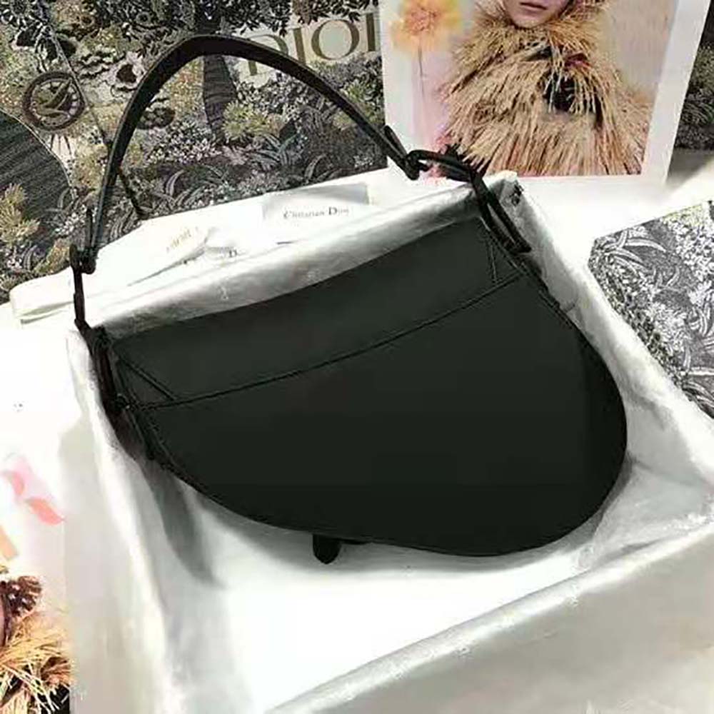 Side angle showing curved silhouette of Dior Women Mini Saddle Bag Black Ultramatte Calfskin