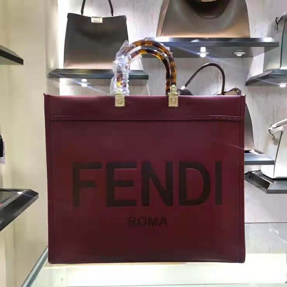 Close-up of gold hardware on Fendi Women Sunshine Shopper Burgundy Leather Shopper-Maroon