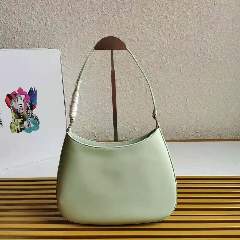 Side profile showing curved silhouette of Prada Cleo Brushed Leather Shoulder Bag-Aqua